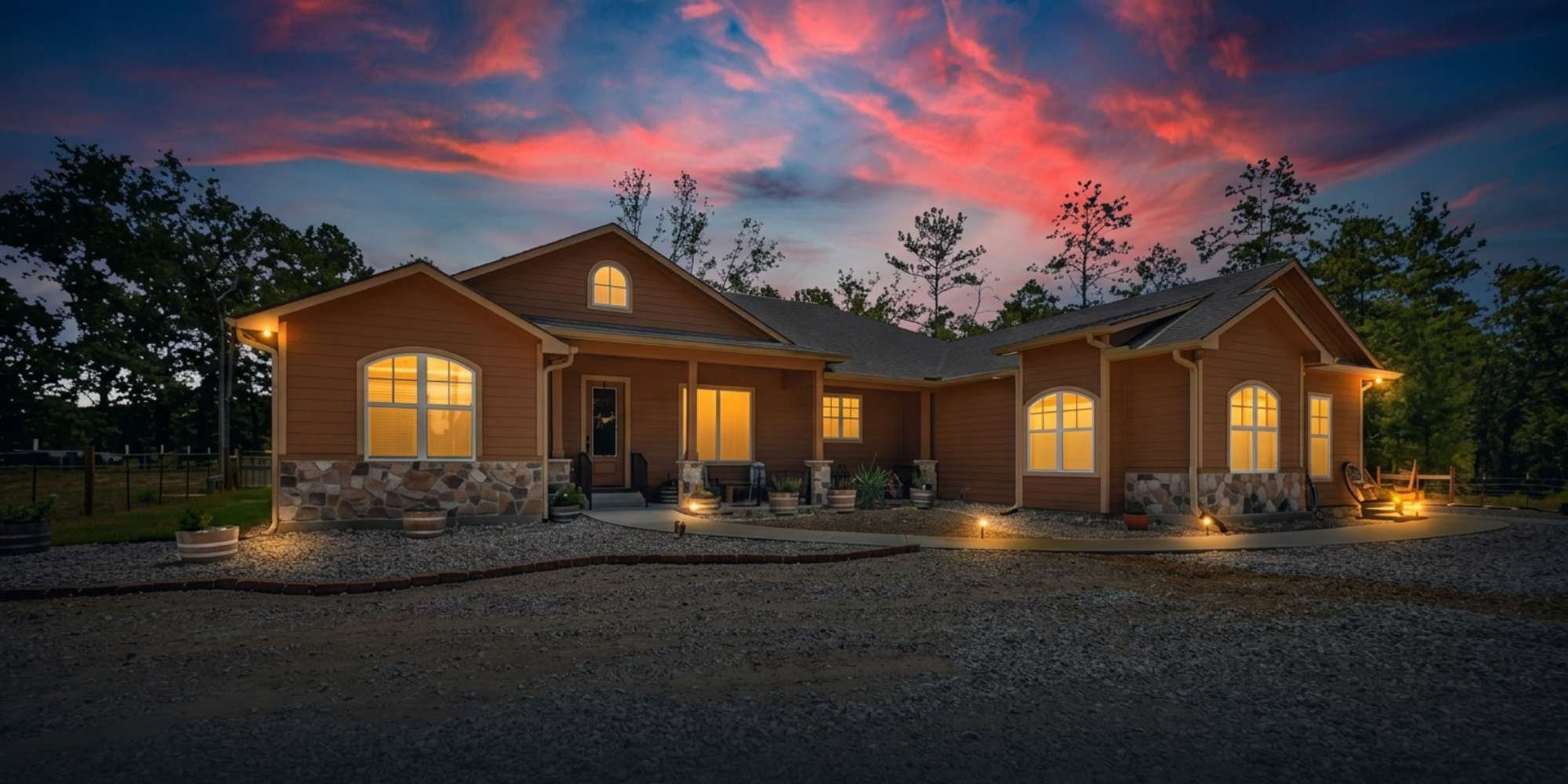 custom home with the evening sky and illumination by Wonderview Custom Homes
