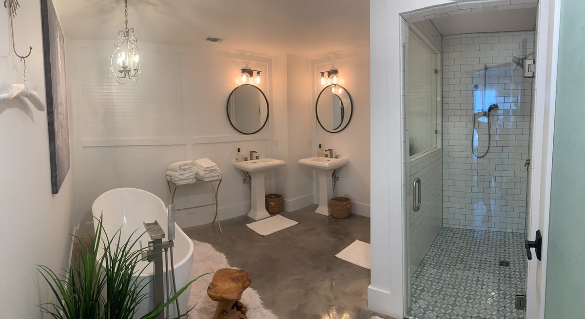 Luxury commercial bathroom with freestanding tub and walk-in tile shower by Wonderview Home Services in Navasota, TX.-optimized