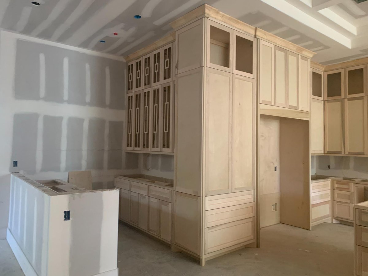 Custom kitchen cabinetry installation in progress by Wonderview Home Services for a residential new construction project in Hous-optimized