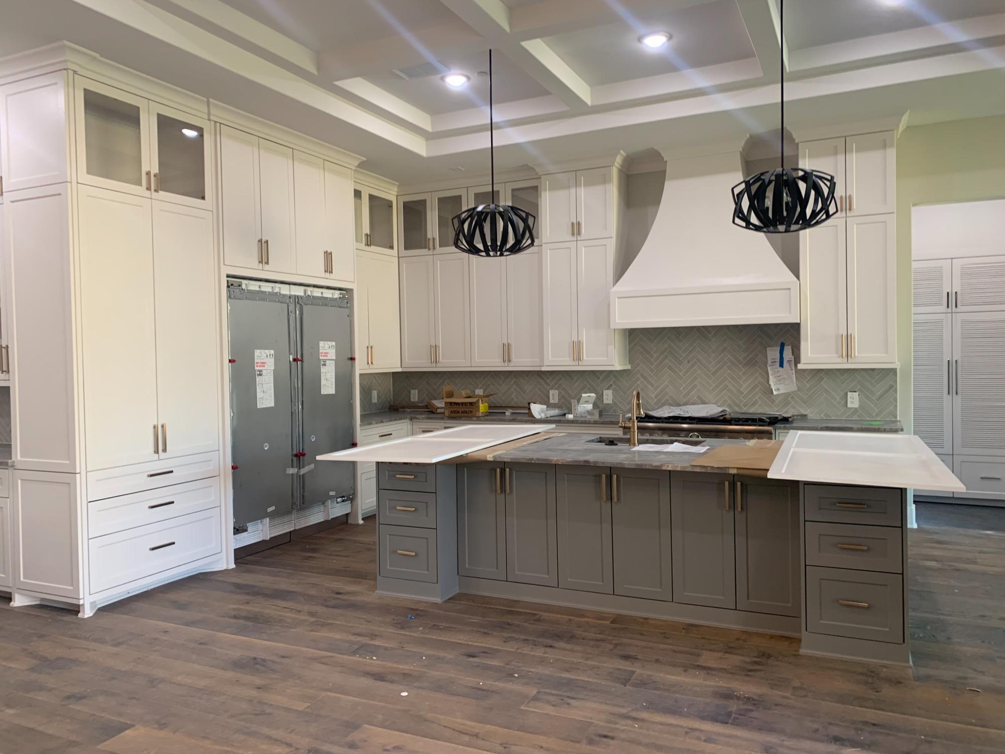 Luxury custom kitchen with coffered ceiling and oversized island by Wonderview Home Services in Houston, TX Luxury custom kitchen with coffered ceiling and oversized island by Wonderview Home Services in Houston, TX