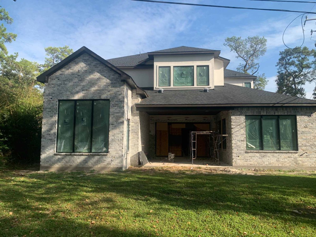 Rear exterior of a luxury residential new construction home by Wonderview Home Services in Houston, TX.