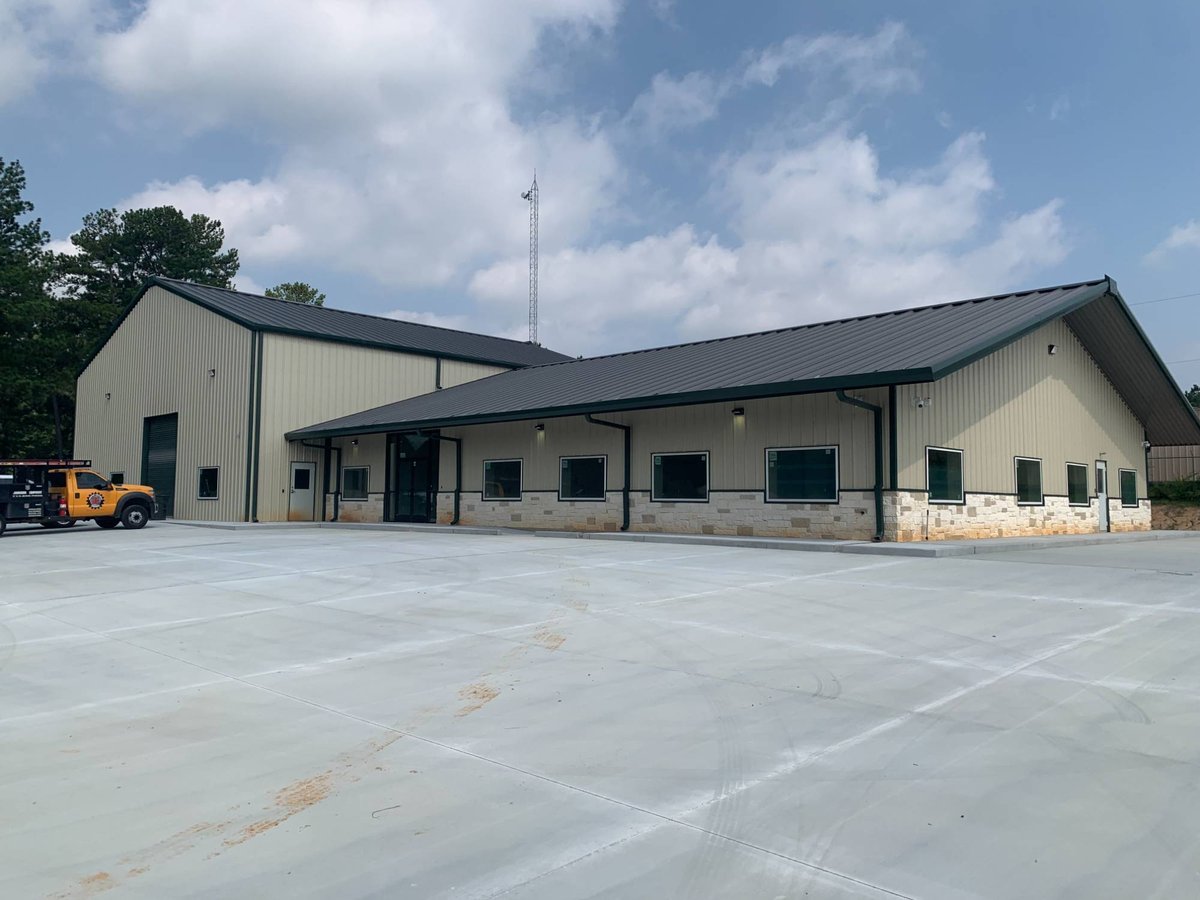 Commercial new construction facility exterior by Wonderview Home Services in New Waverly, TX featuring metal siding and expansiv-optimized