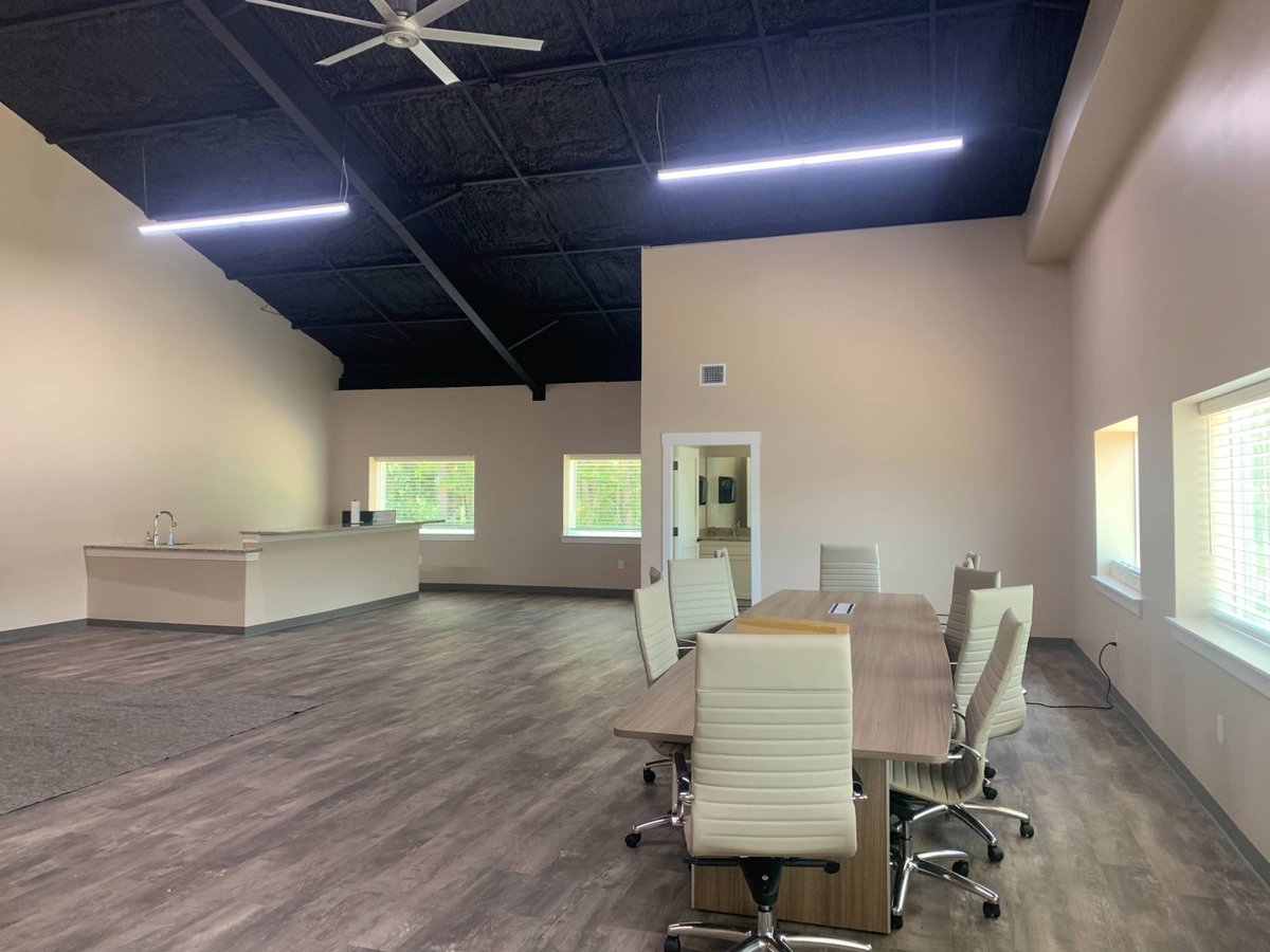 Commercial new construction office featuring conference table and open workspace by Wonderview Home Services in New Waverly, TX.-optimized