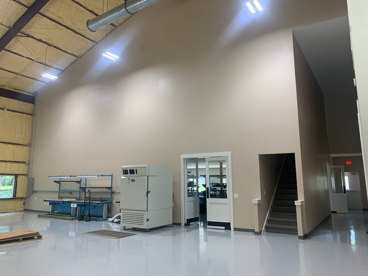 Finished commercial warehouse interior with polished floors and office entry by Wonderview Home Services in New Waverly, TX-optimized