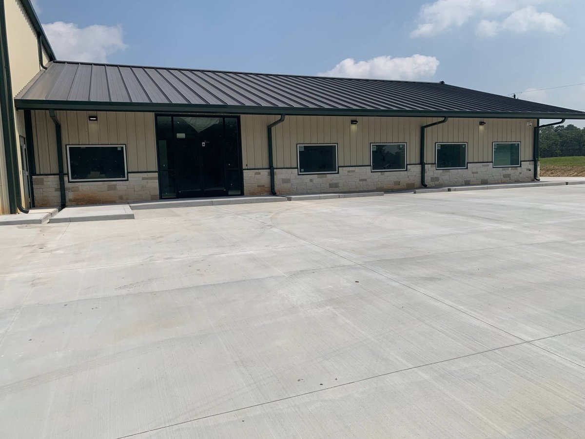 Front office exterior of a commercial new construction project by Wonderview Home Services in New Waverly, TX.-optimized