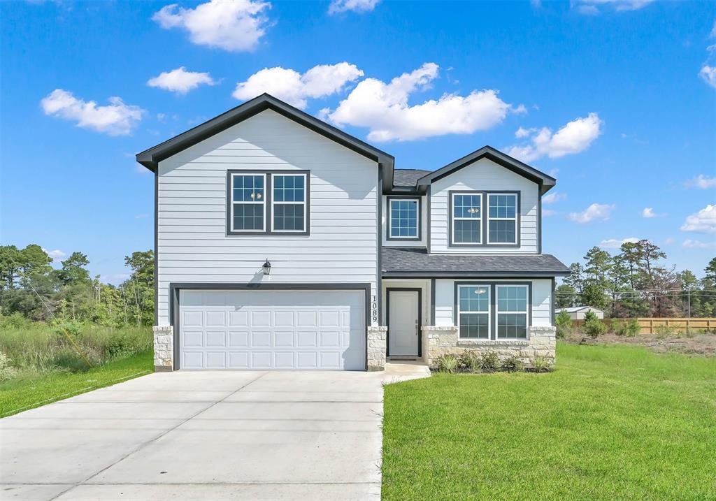 Two-story residential new construction home with modern farmhouse exterior by Wonderview Home Services in Cleveland, TX.-optimiz-optimized
