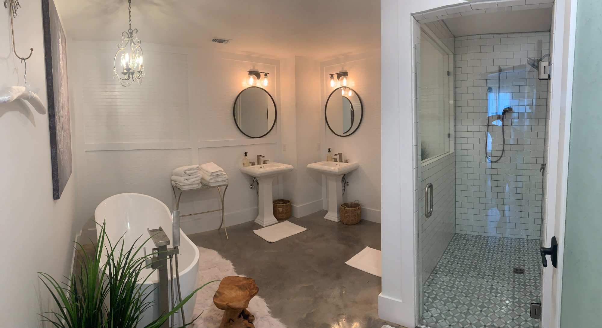 Luxury commercial bathroom with freestanding tub and walk-in tile shower by Wonderview Home Services in Navasota, TX.-optimized